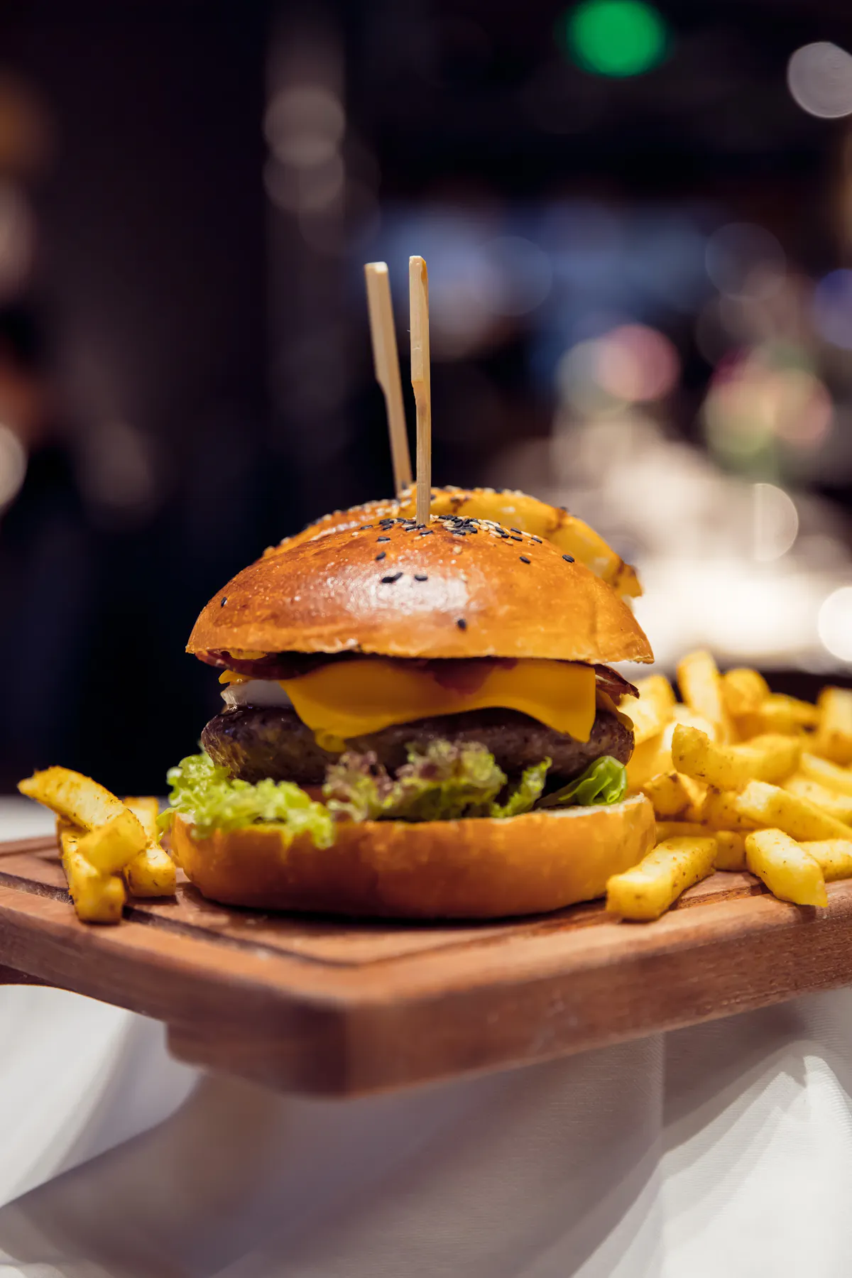 a close up of a sandwich and fries on a plate