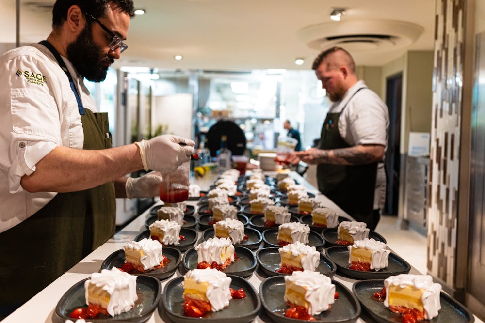 a man standing in a kitchen preparing food