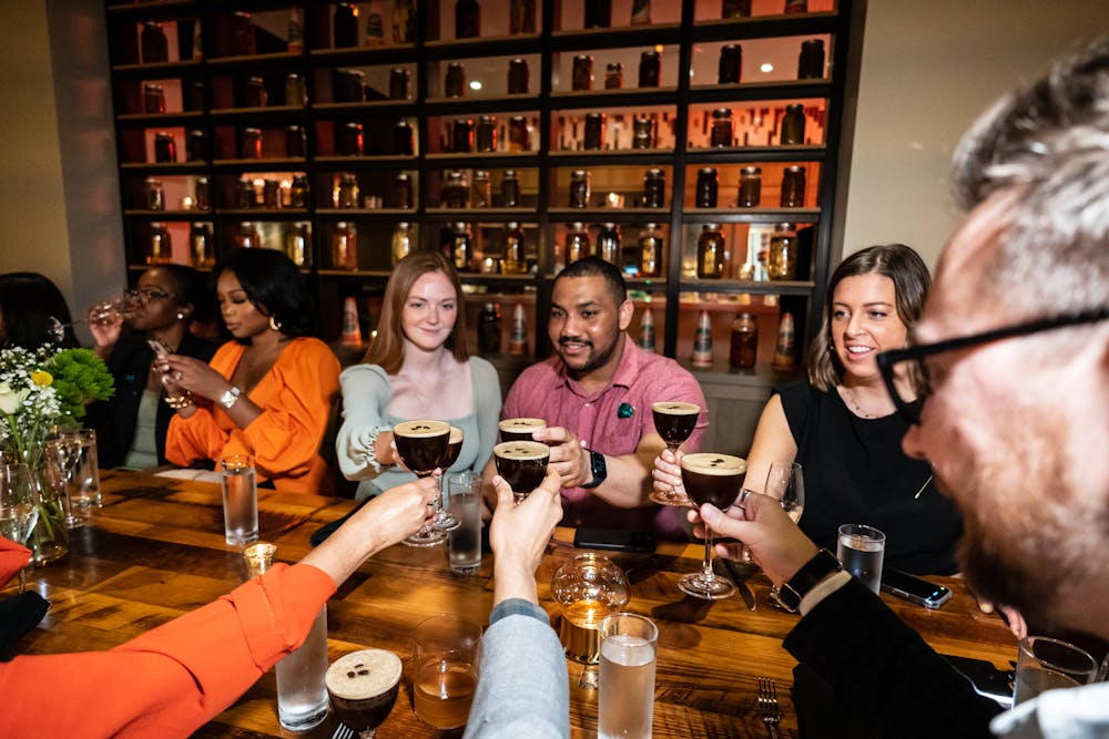 a group of people sitting at a table