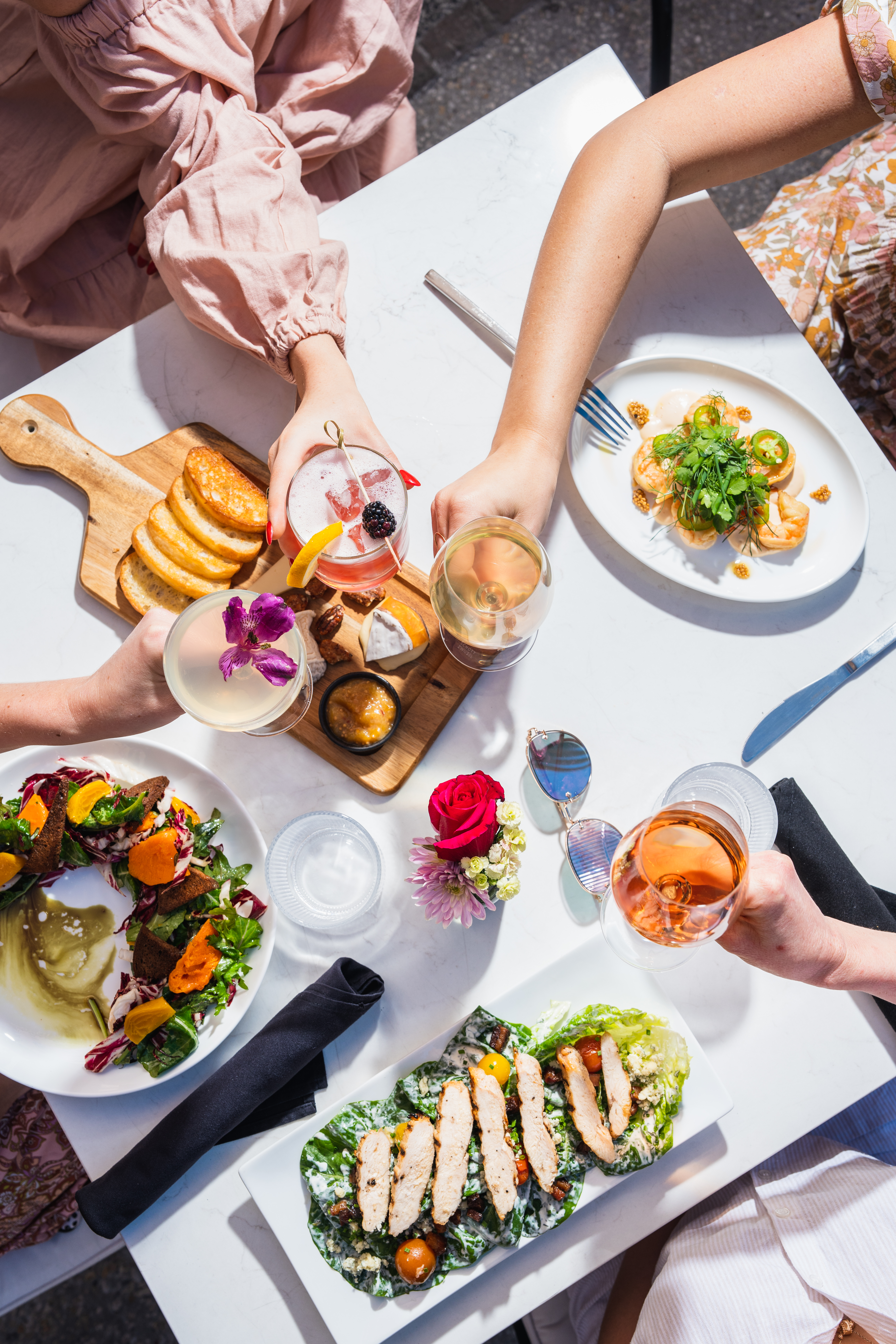 a person sitting at a table with a plate of food