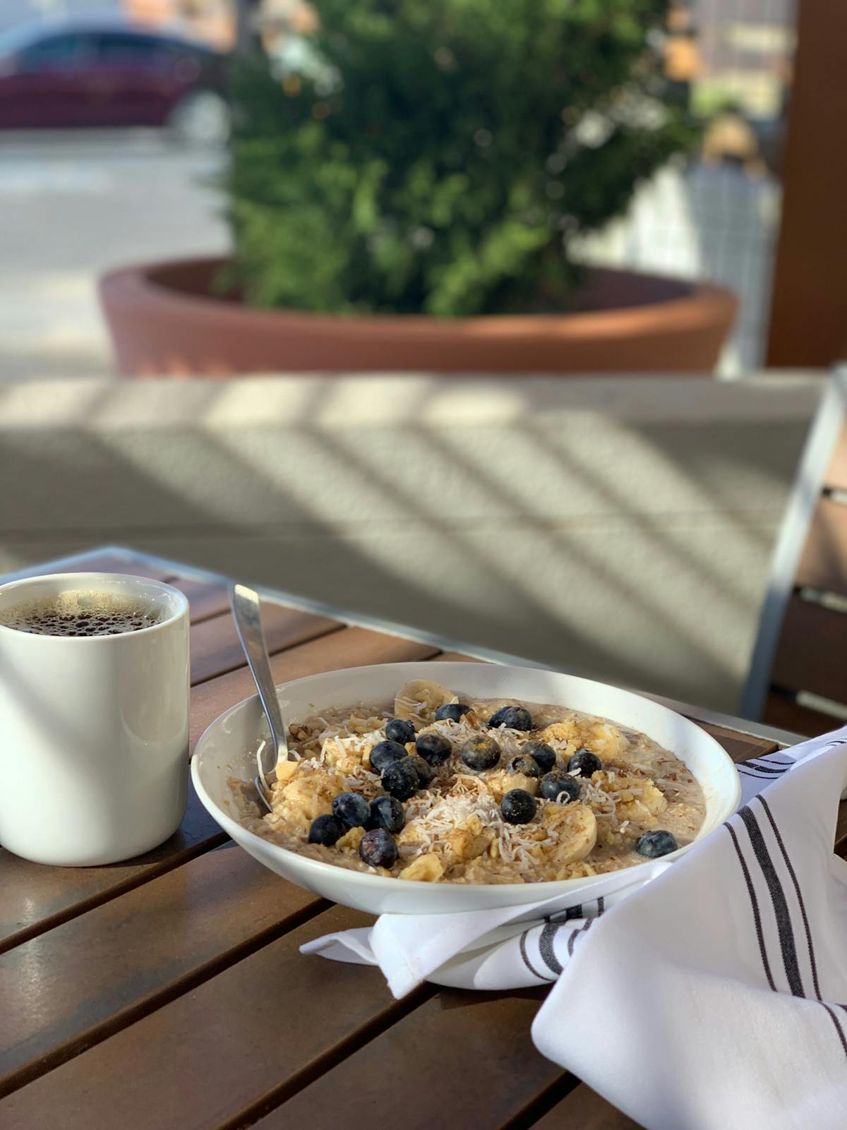 a plate of food and a cup of coffee on a table