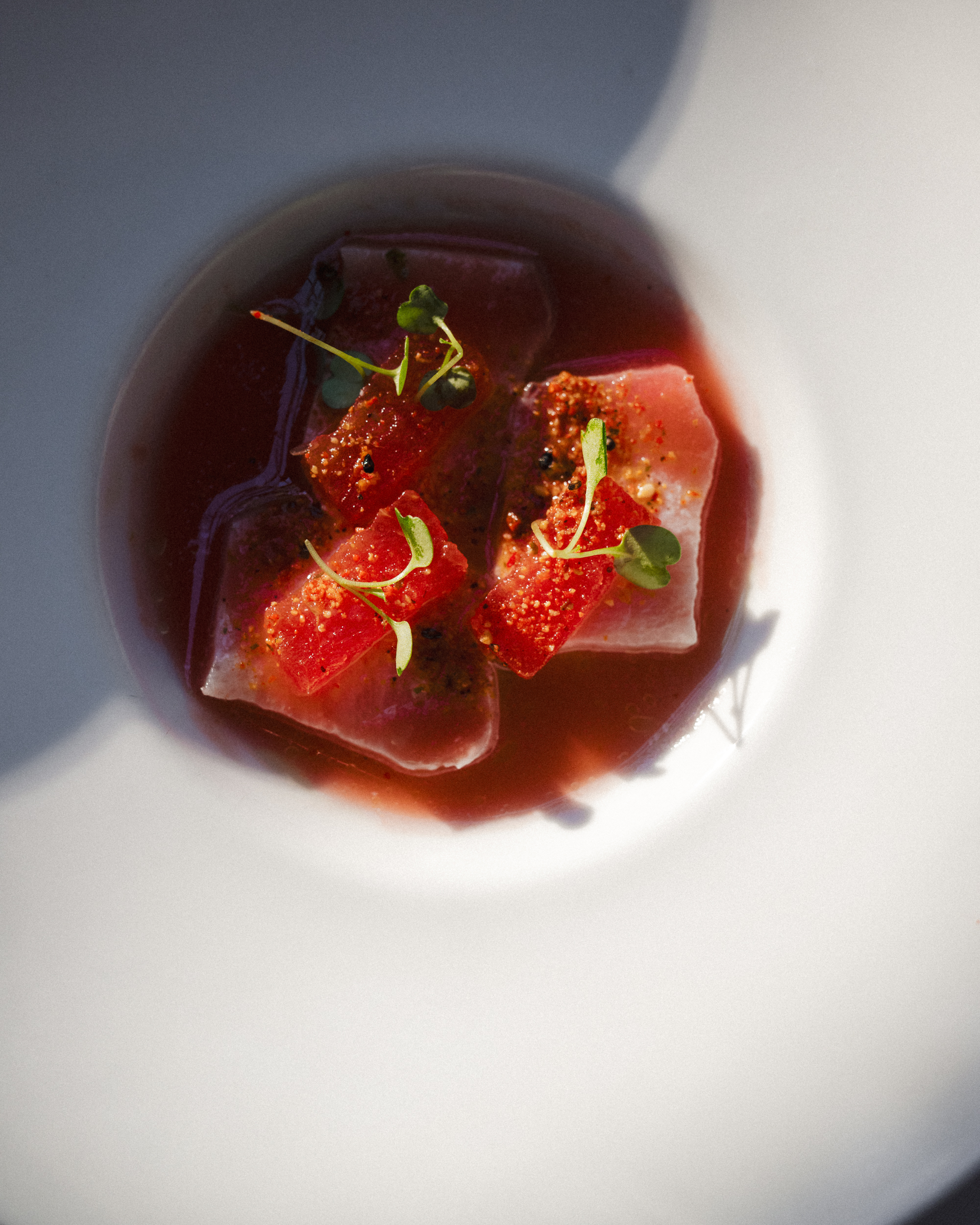 a bowl of fruit on a plate