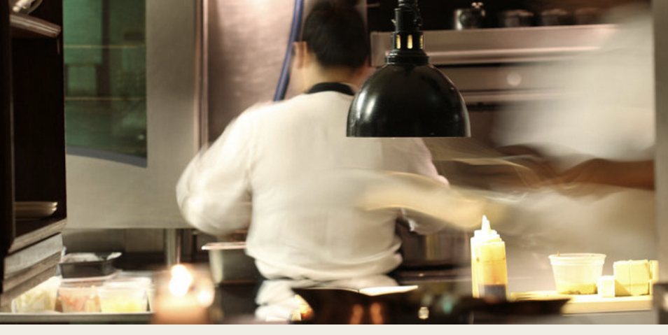 a person preparing food in a kitchen