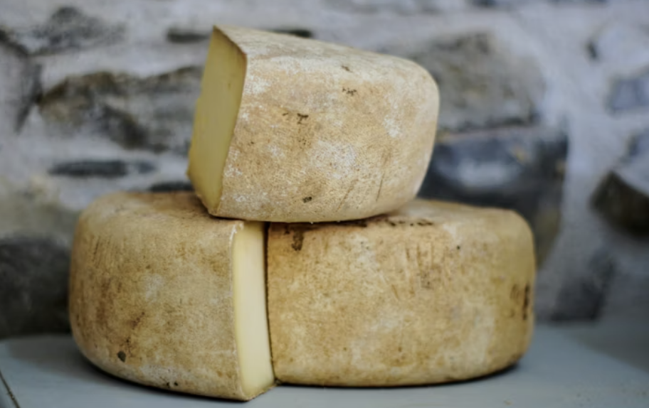 a stack of cheeses stacked on top of each other