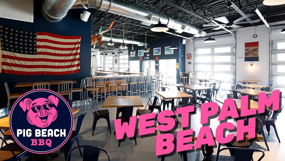 a table that has a sign on the side of a building