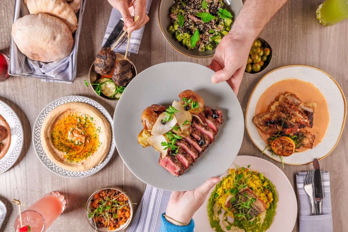 a bunch of different types of food on a plate on a table