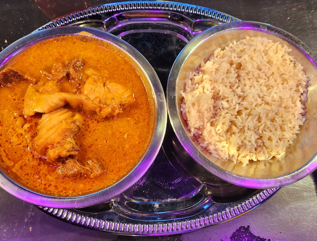 a bowl of food sitting on a table