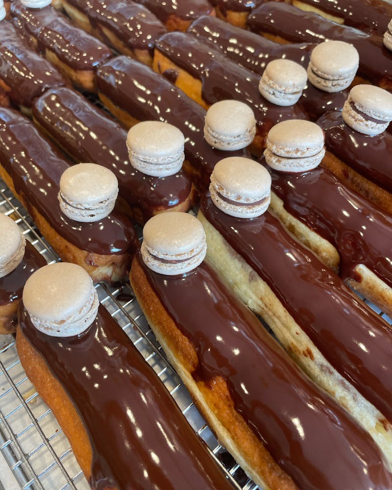 a bunch of hot dogs on a grill