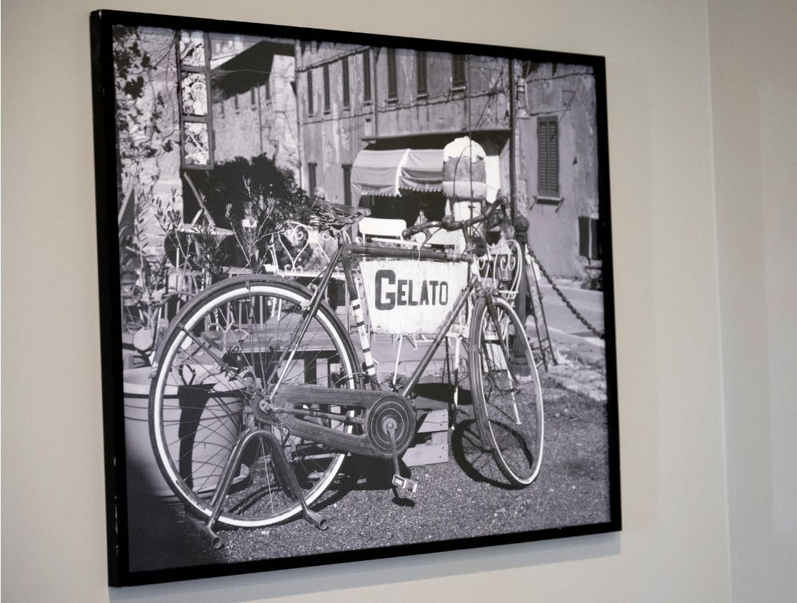 a bicycle leaning against a wall