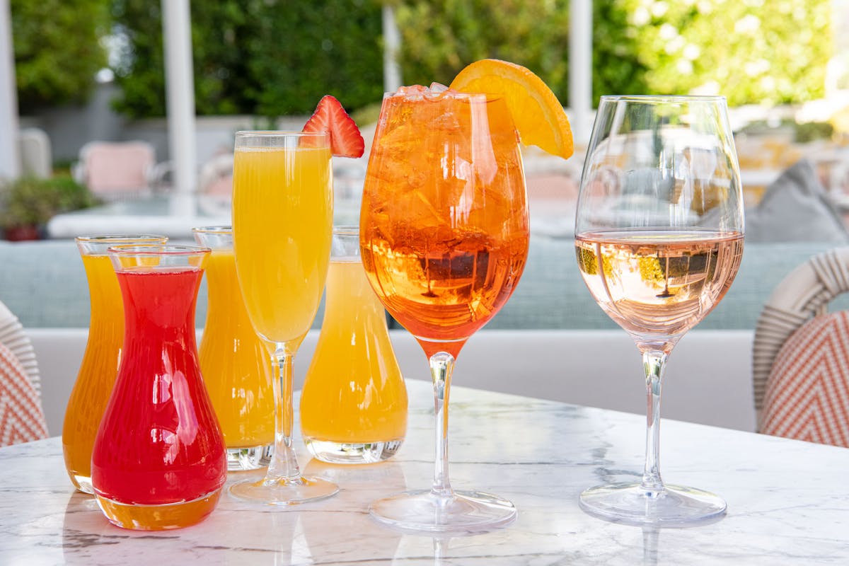 a group of people sitting at a table with wine glasses