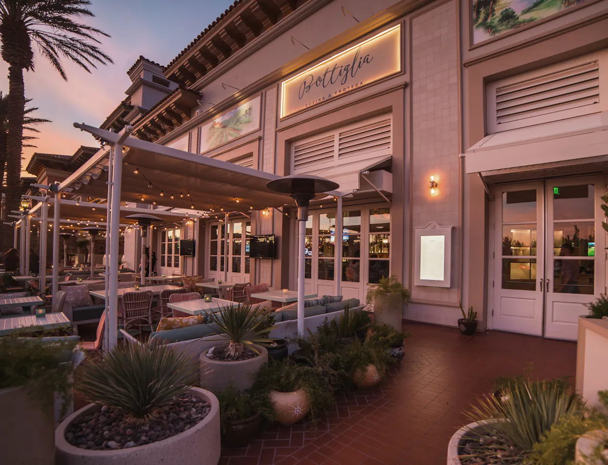 a building with a patio and tables