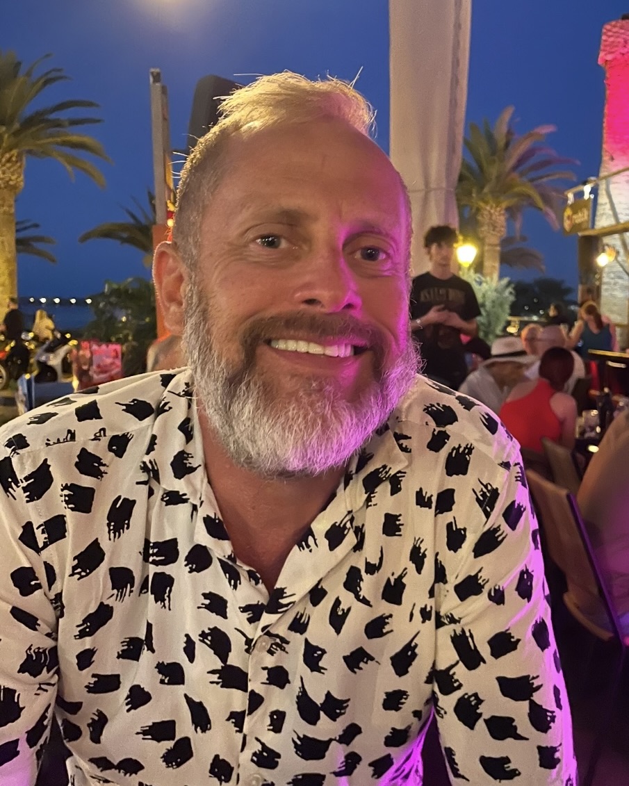 a man wearing a pink shirt