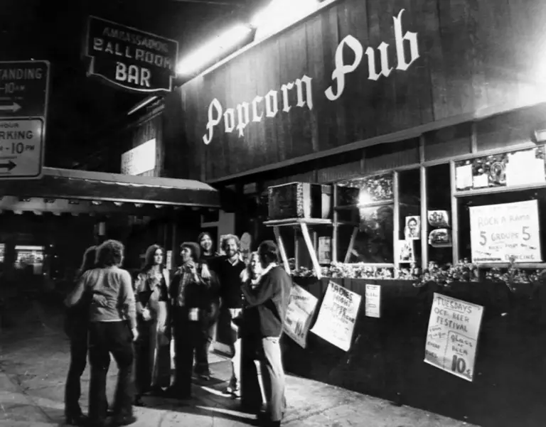 people standing outside a club