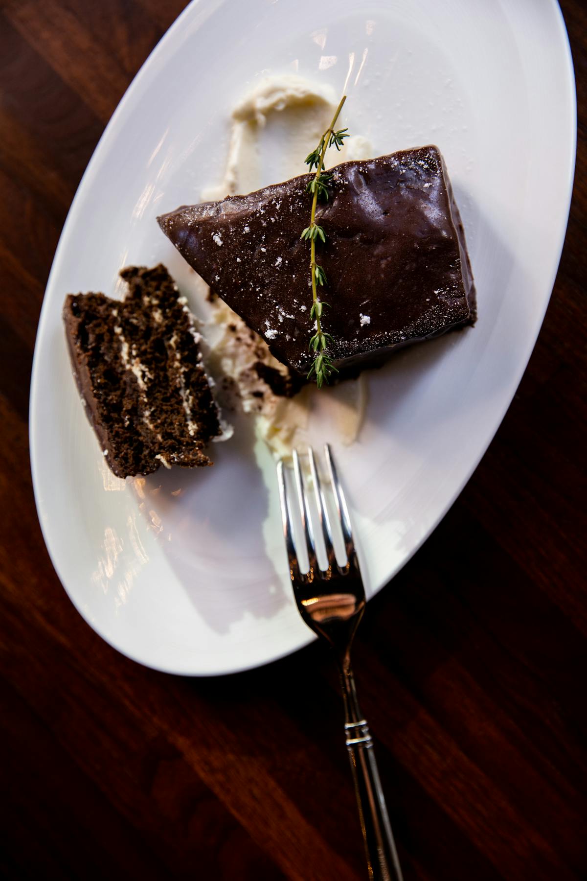 a piece of chocolate cake on a plate with a fork