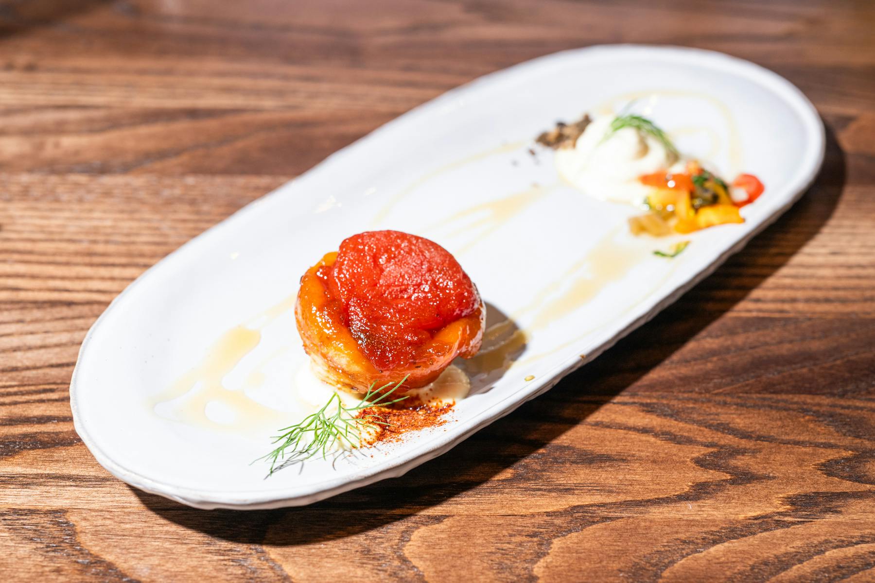 a plate of food on a wooden table