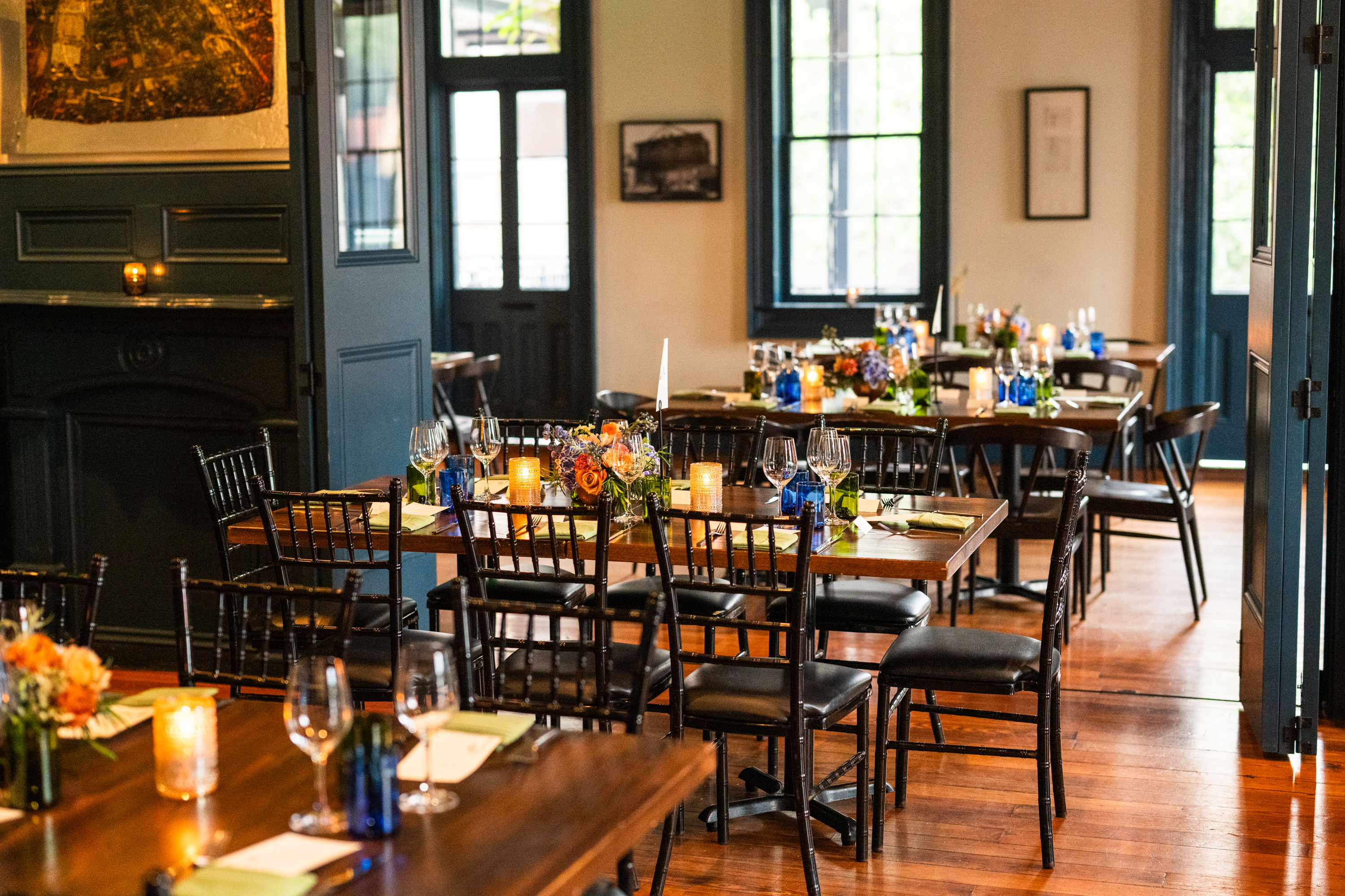 A dining room with tables set for a meal