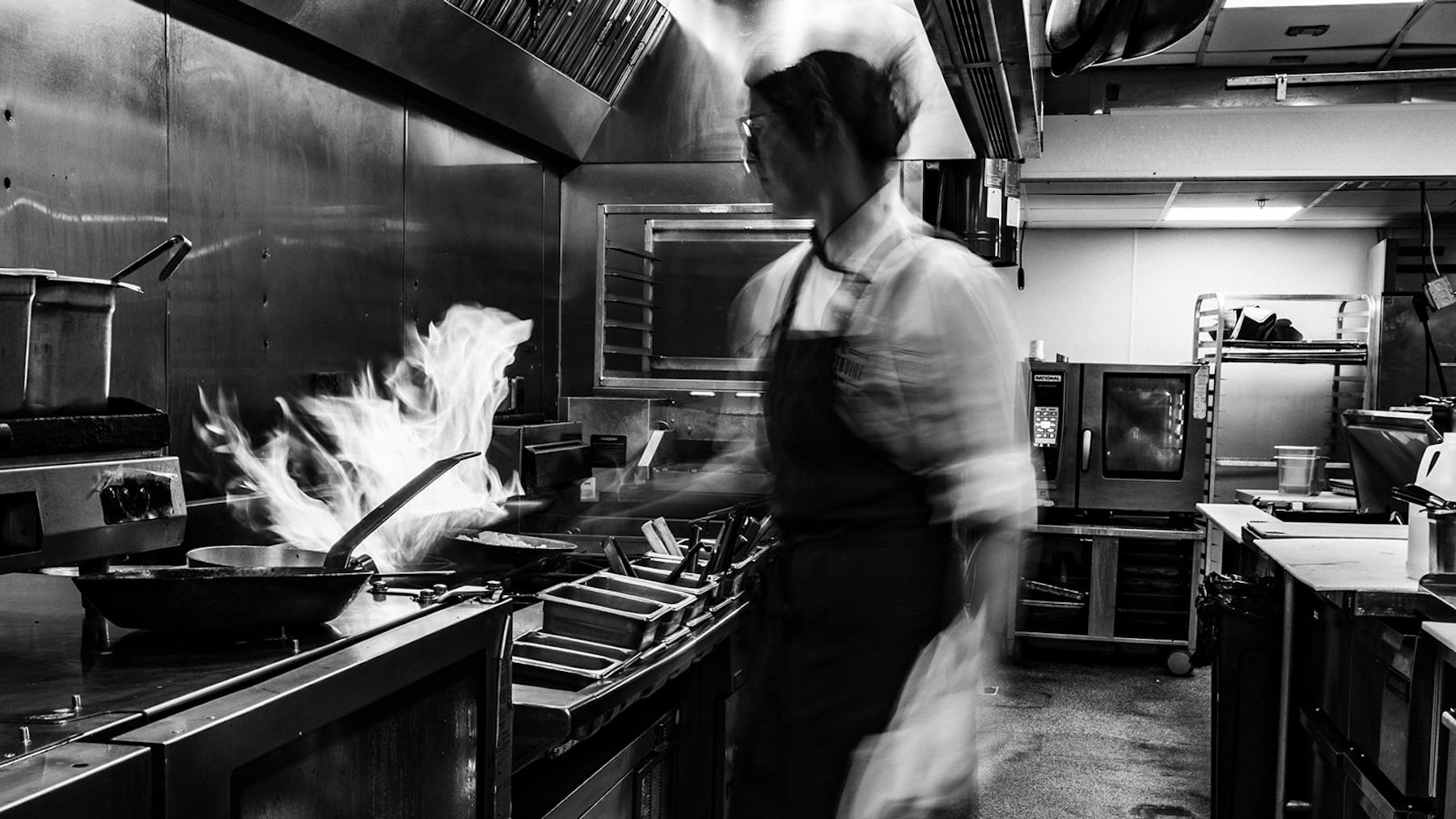 a person cooking in a kitchen