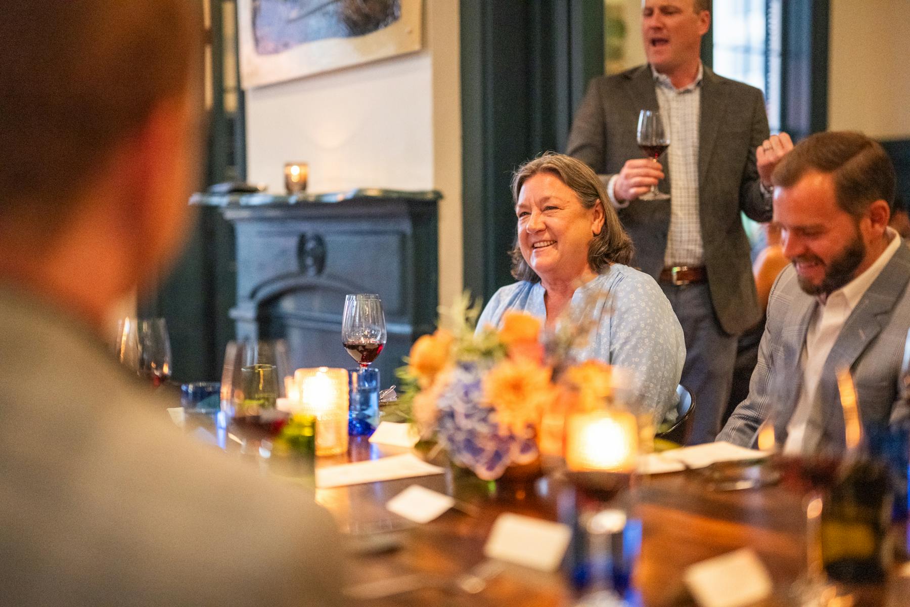 a group of people sitting at a table