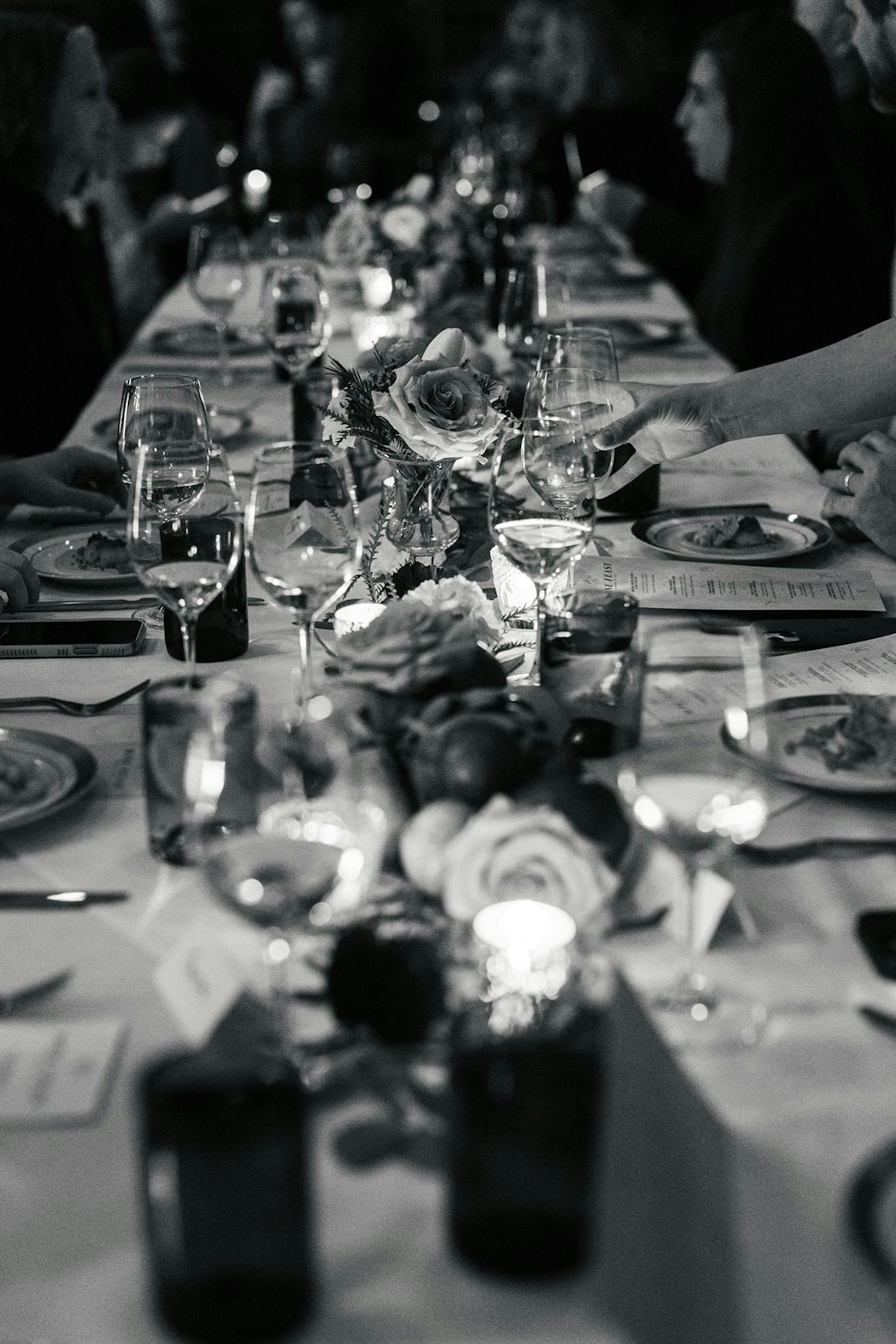 a group of people sitting at a table with wine glasses