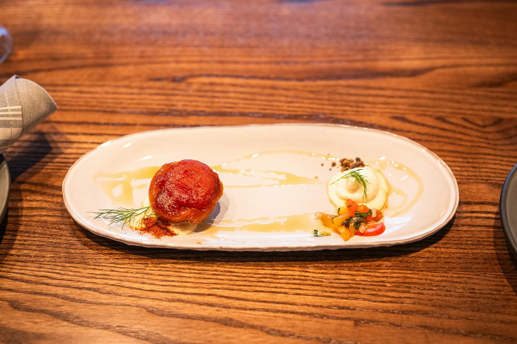 a plate of food on a wooden table