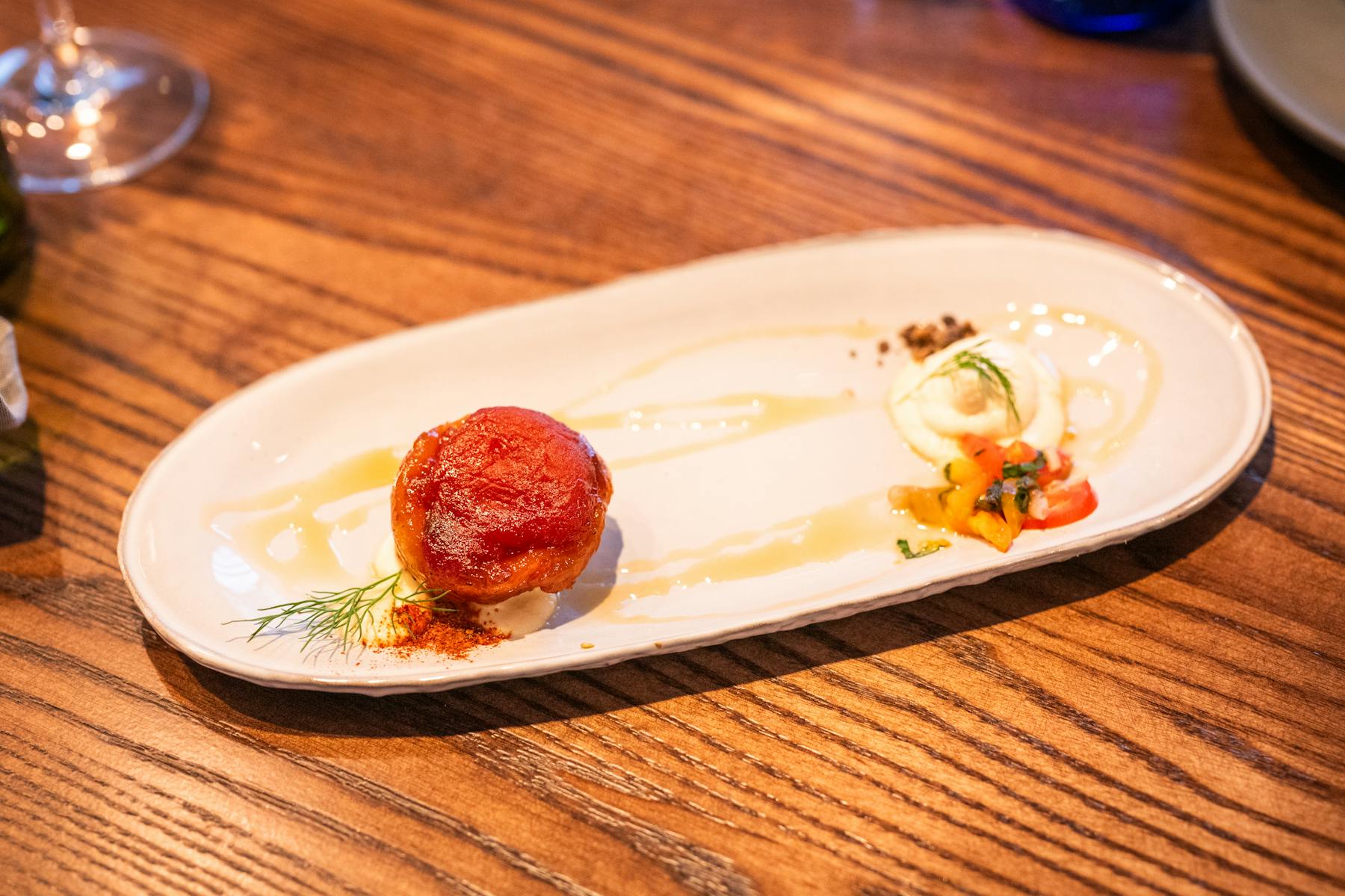 a plate of food sitting on top of a wooden table