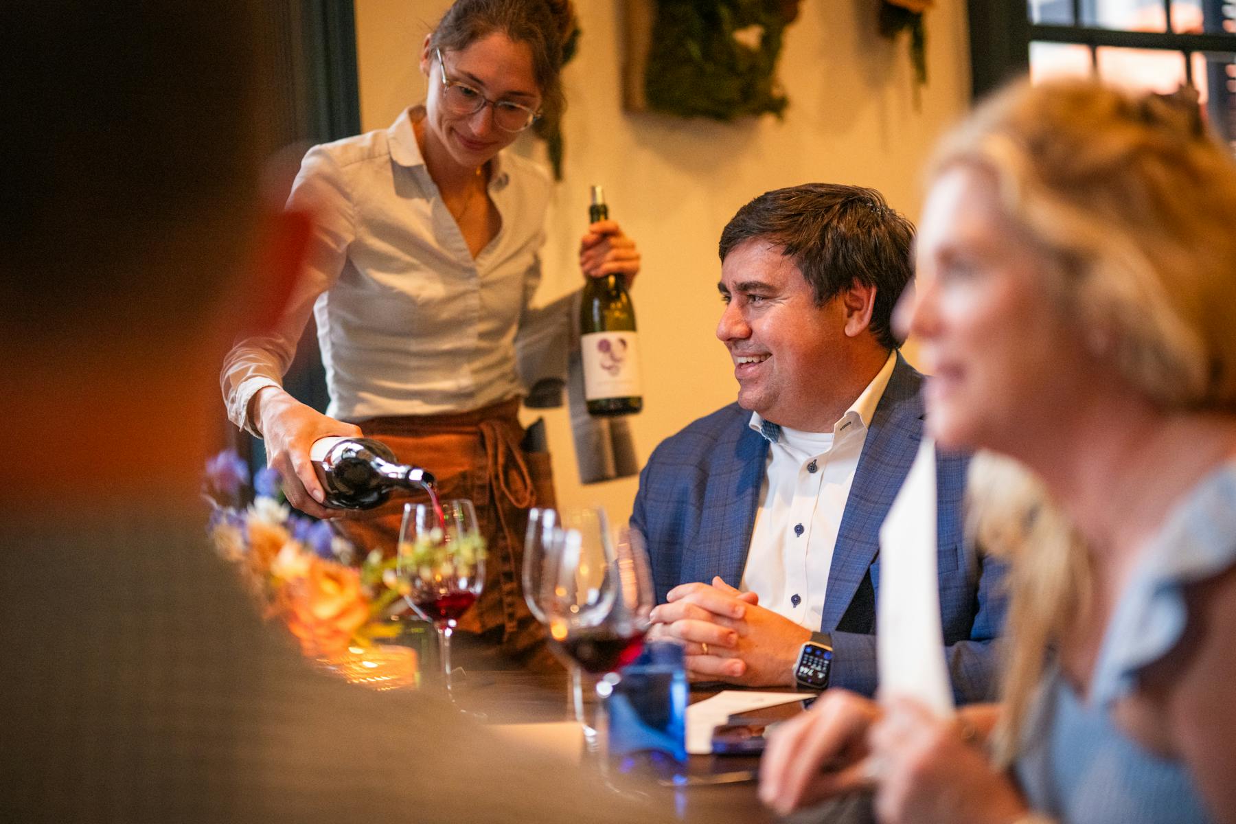 a man holding a glass of wine