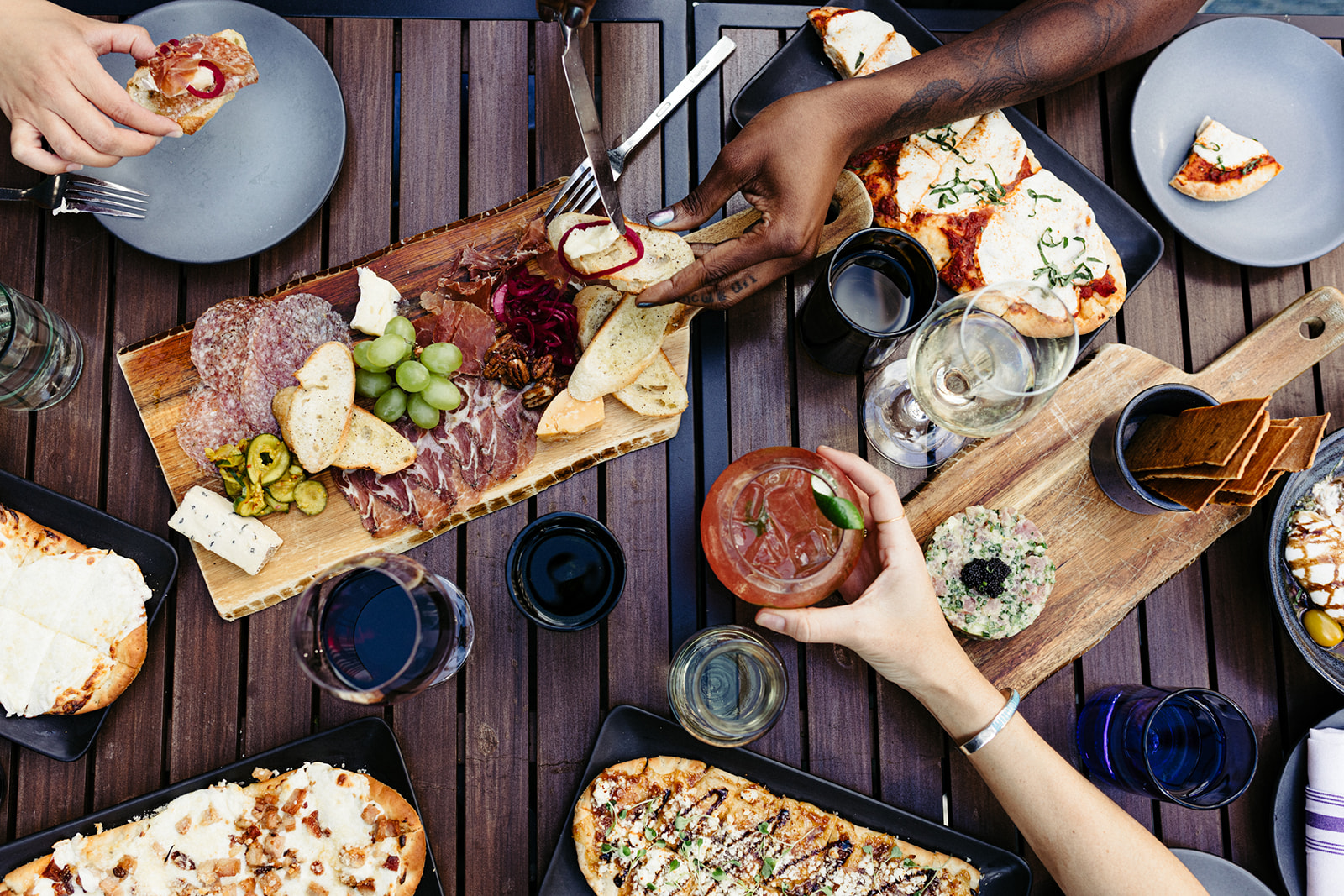 A top-down view of a table with various food items and drinks