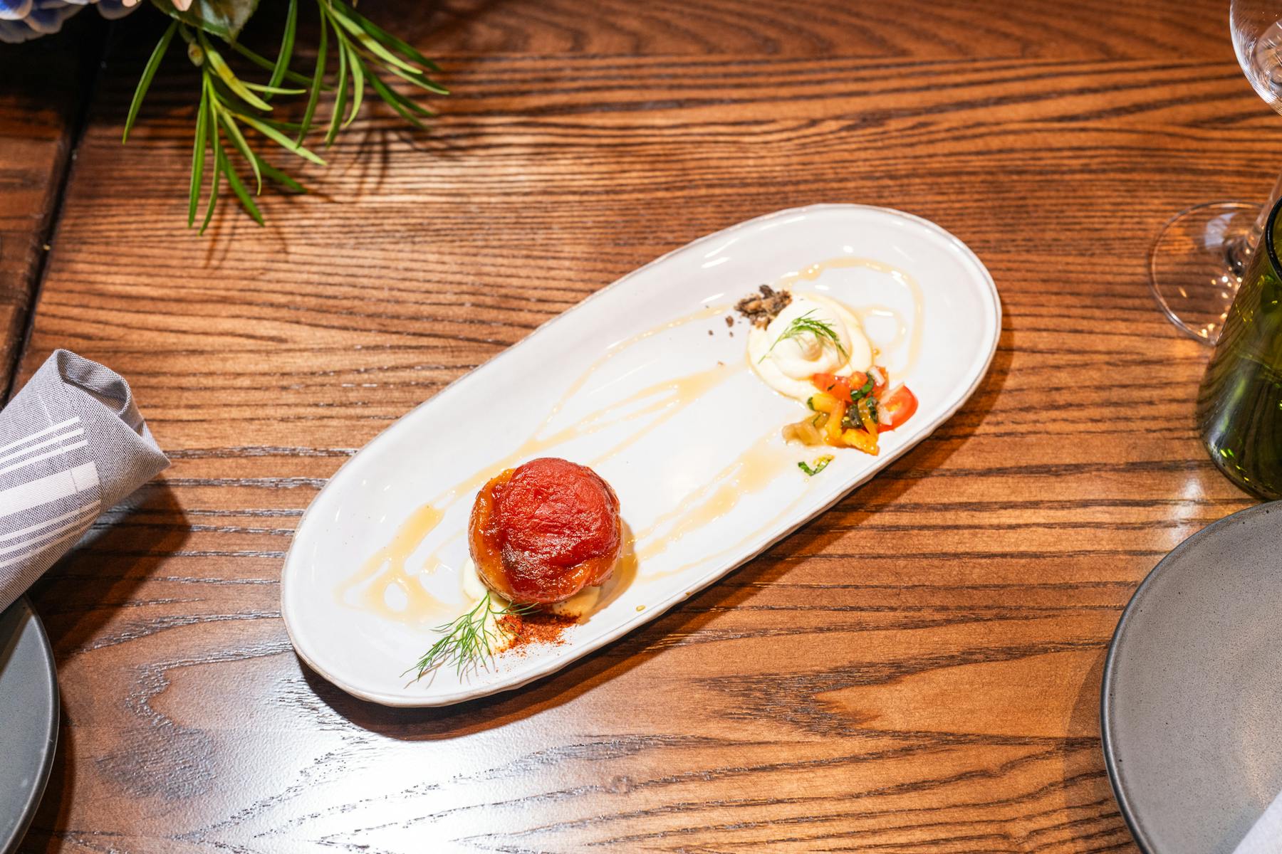 a plate of food sitting on top of a wooden table