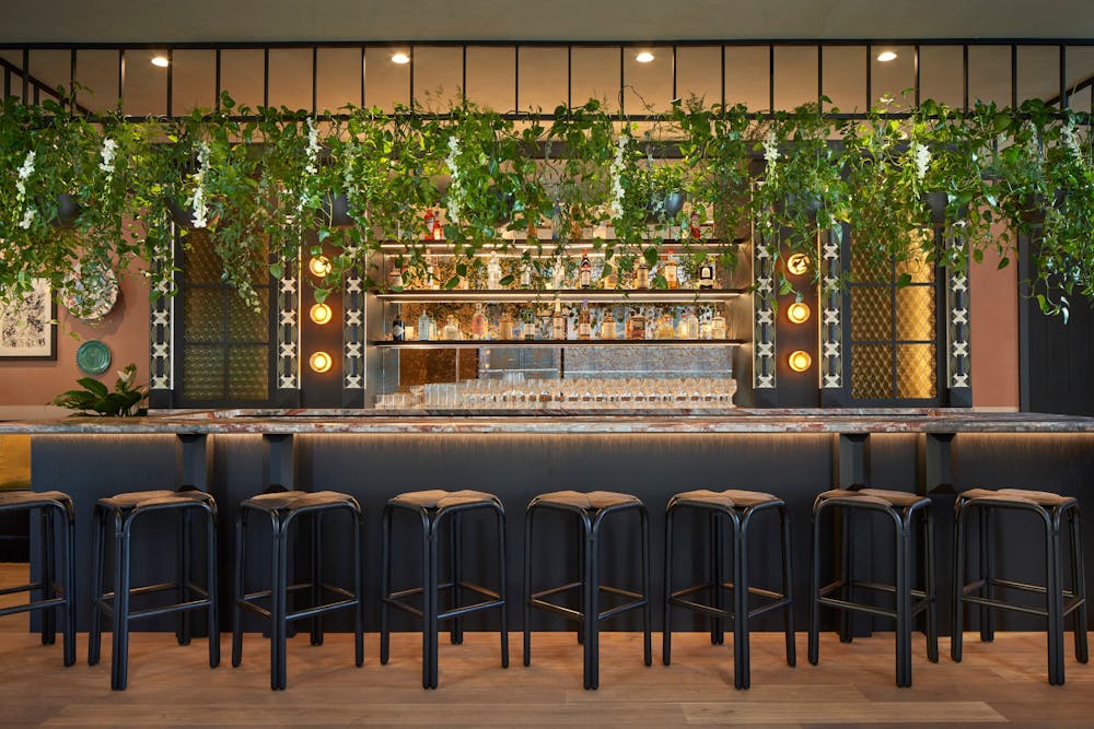 a row of wooden benches sitting on top of a table