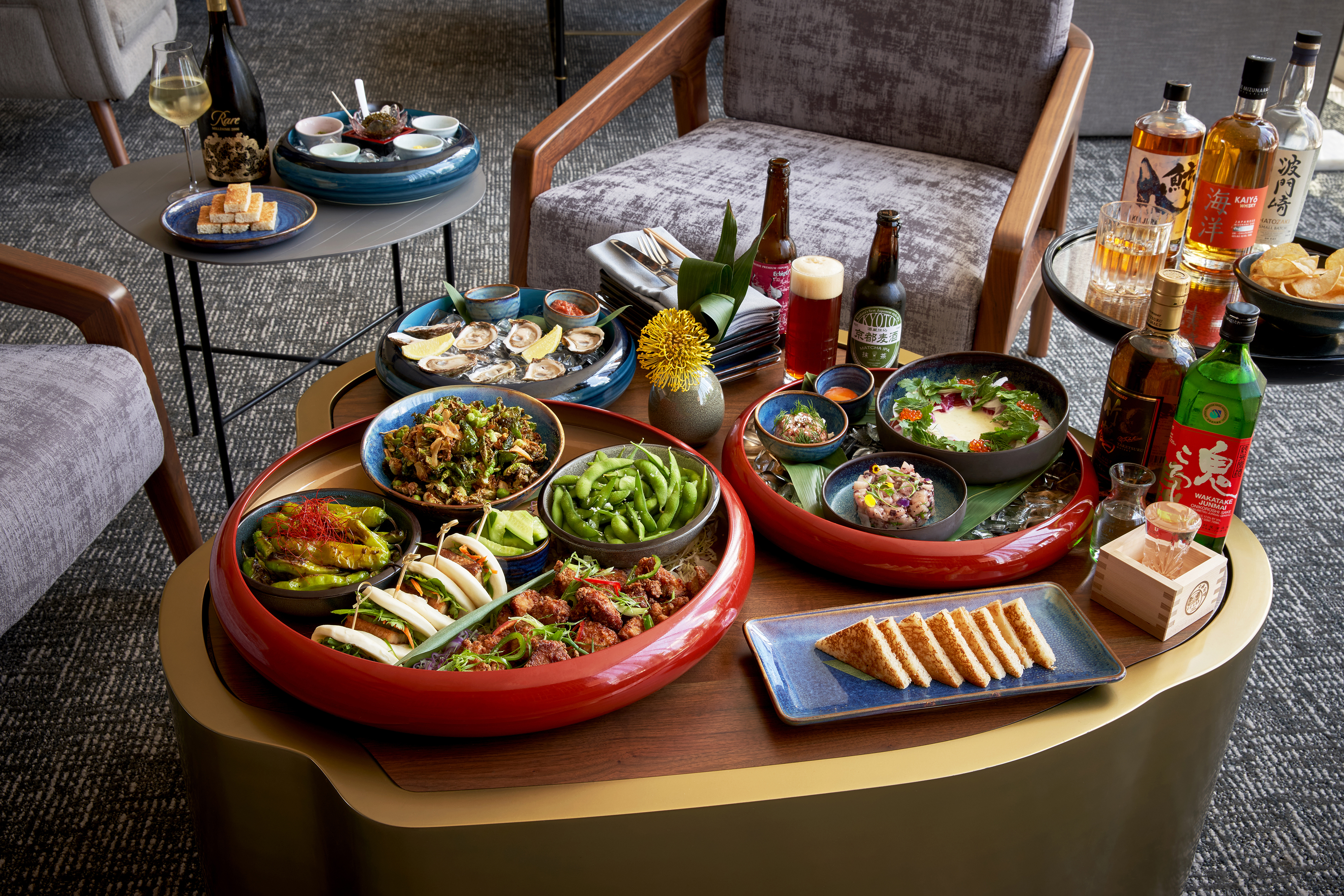 a tray of food on a Several Trays Of Food On A Table With A Selection Of Beers, Wines and Spirits