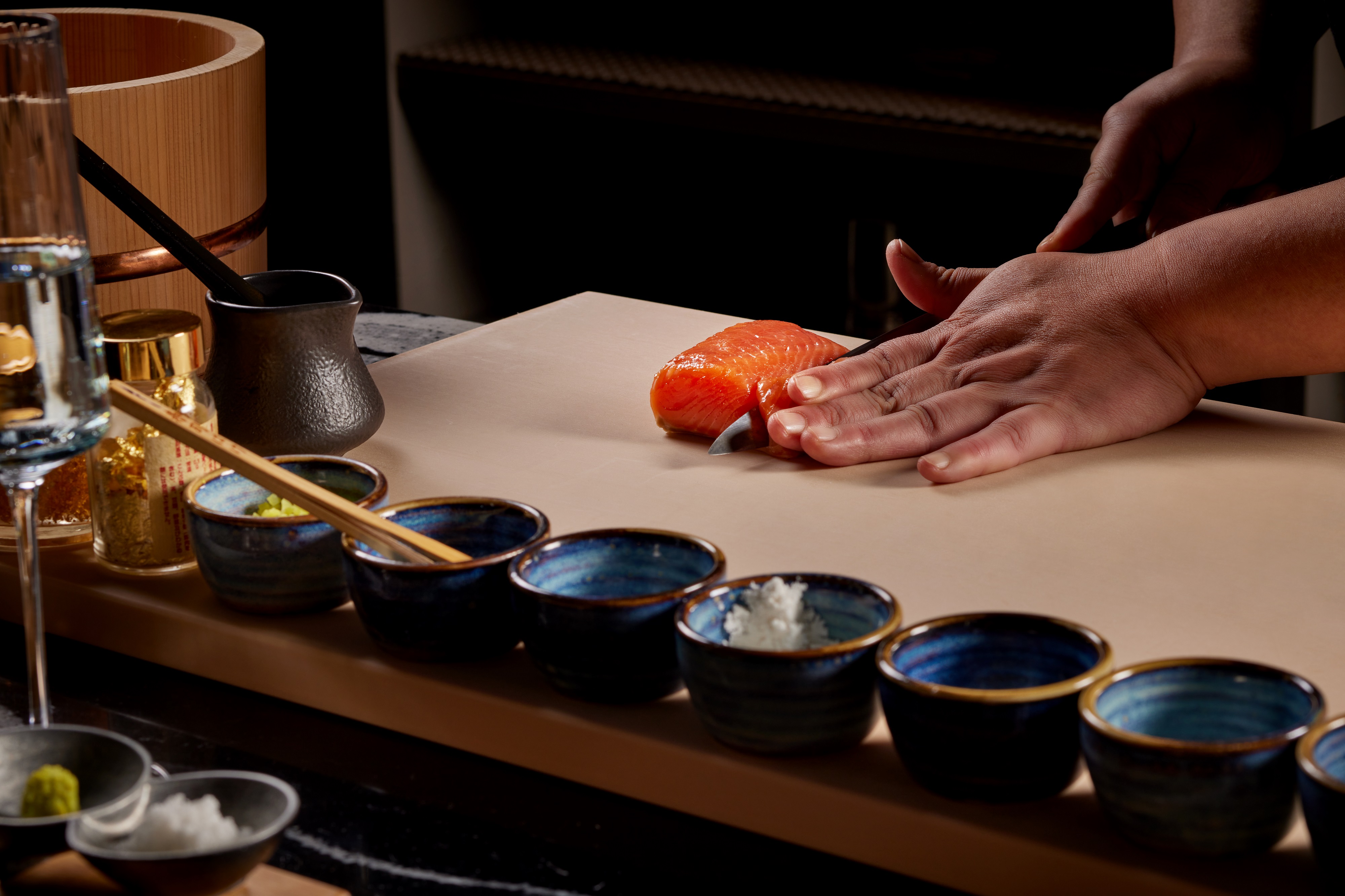 a person preparing food in a bowl on a table