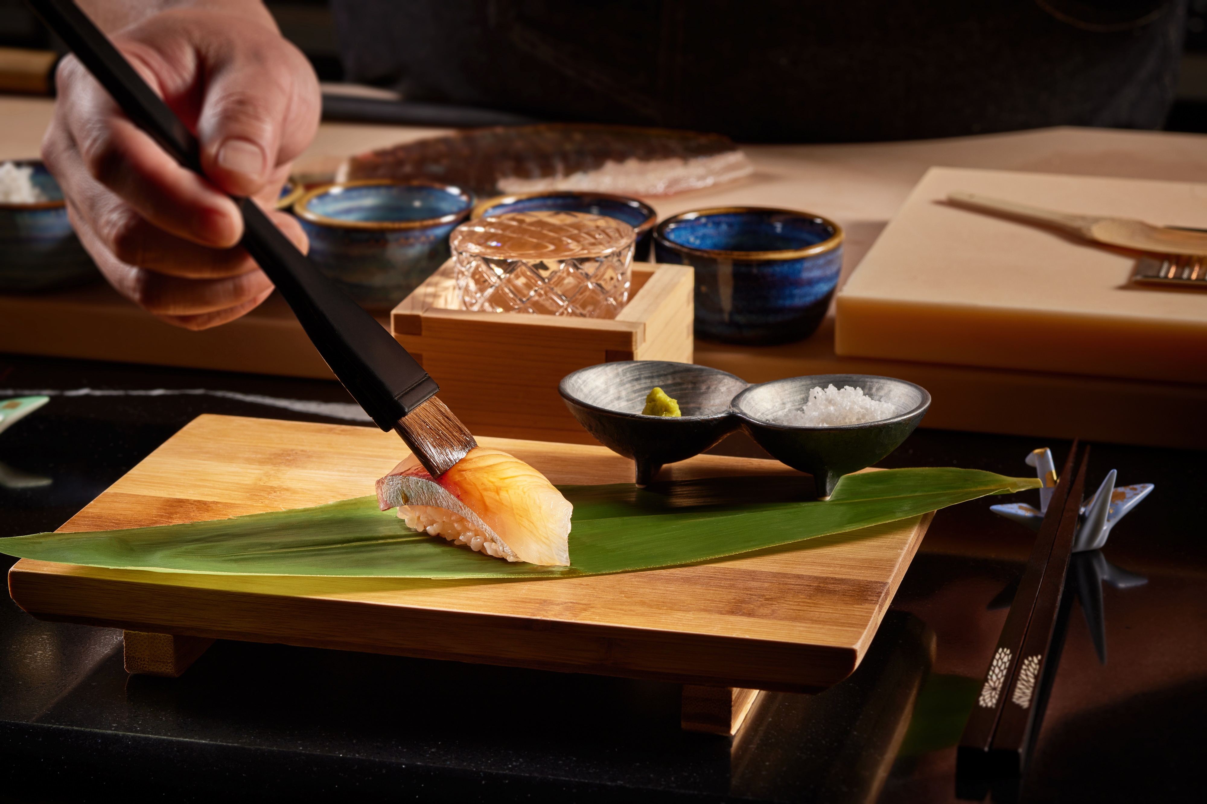a person cutting food on a table