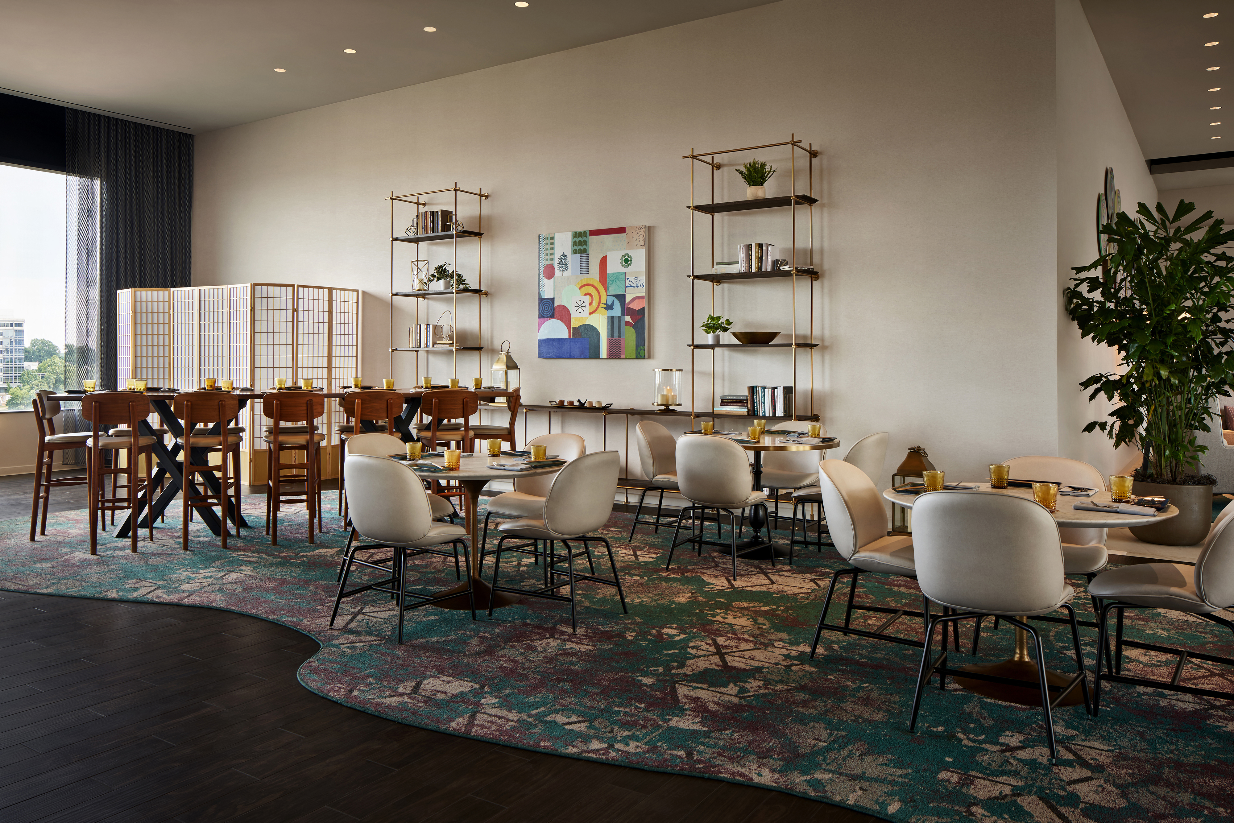 Dining Tables And Chairs Set For Patrons In Dining Room With Large Windows