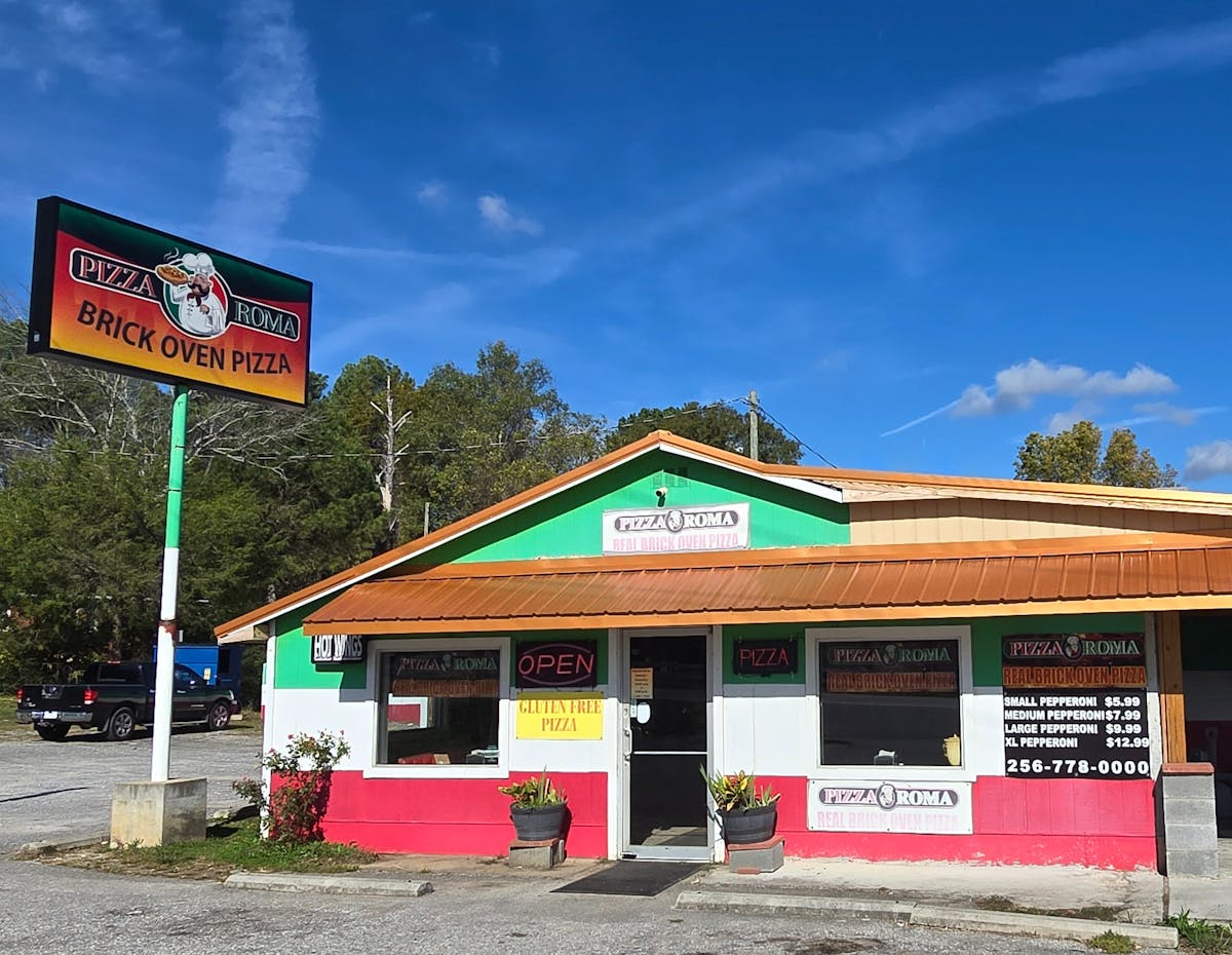 a sign in front of a house