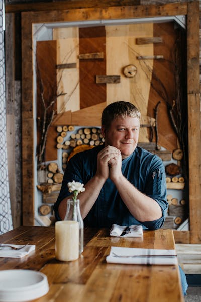 a person sitting on a wooden table