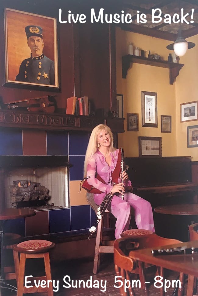 a woman sitting on a table
