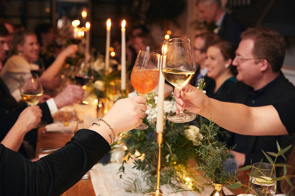 a person holding a glass of wine