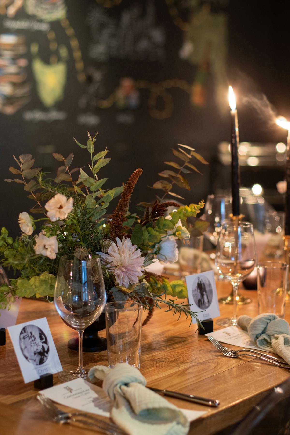 a group of people sitting at a table with wine glasses