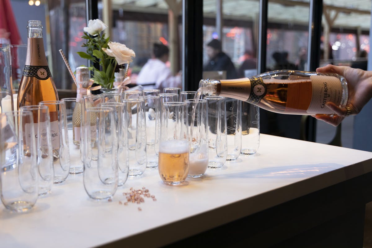 a group of people sitting at a table with wine glasses