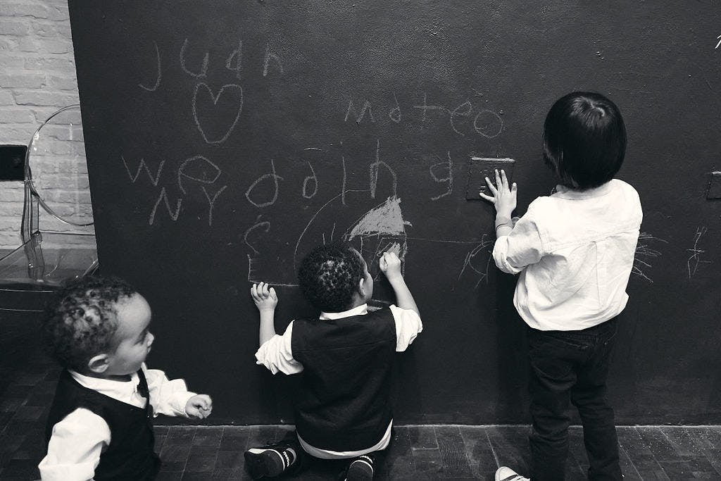 a group of people in a blackboard