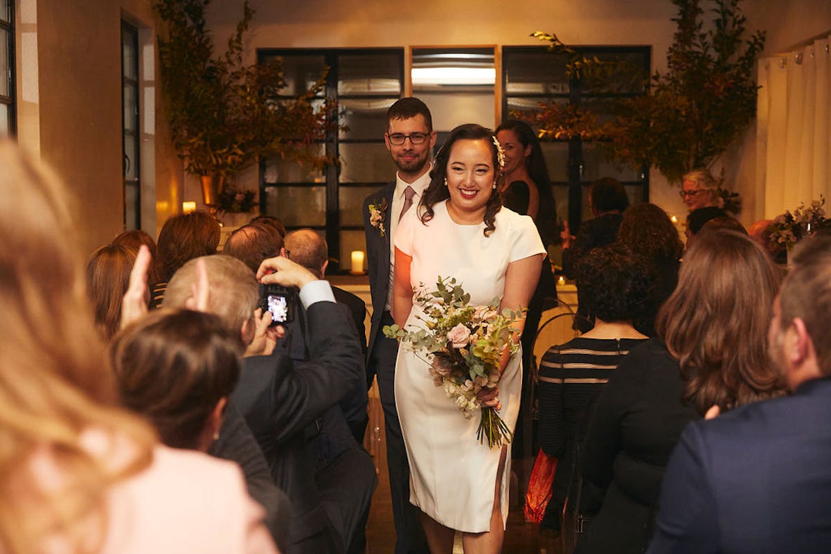 a person standing in front of a group of people posing for the camera