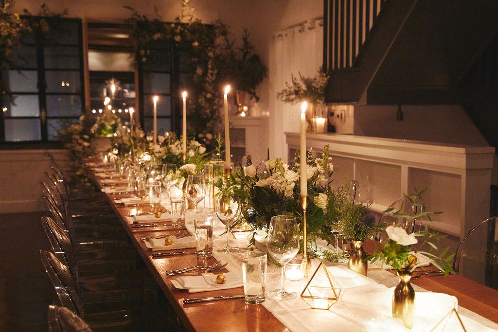 a dining table filled with wine glasses