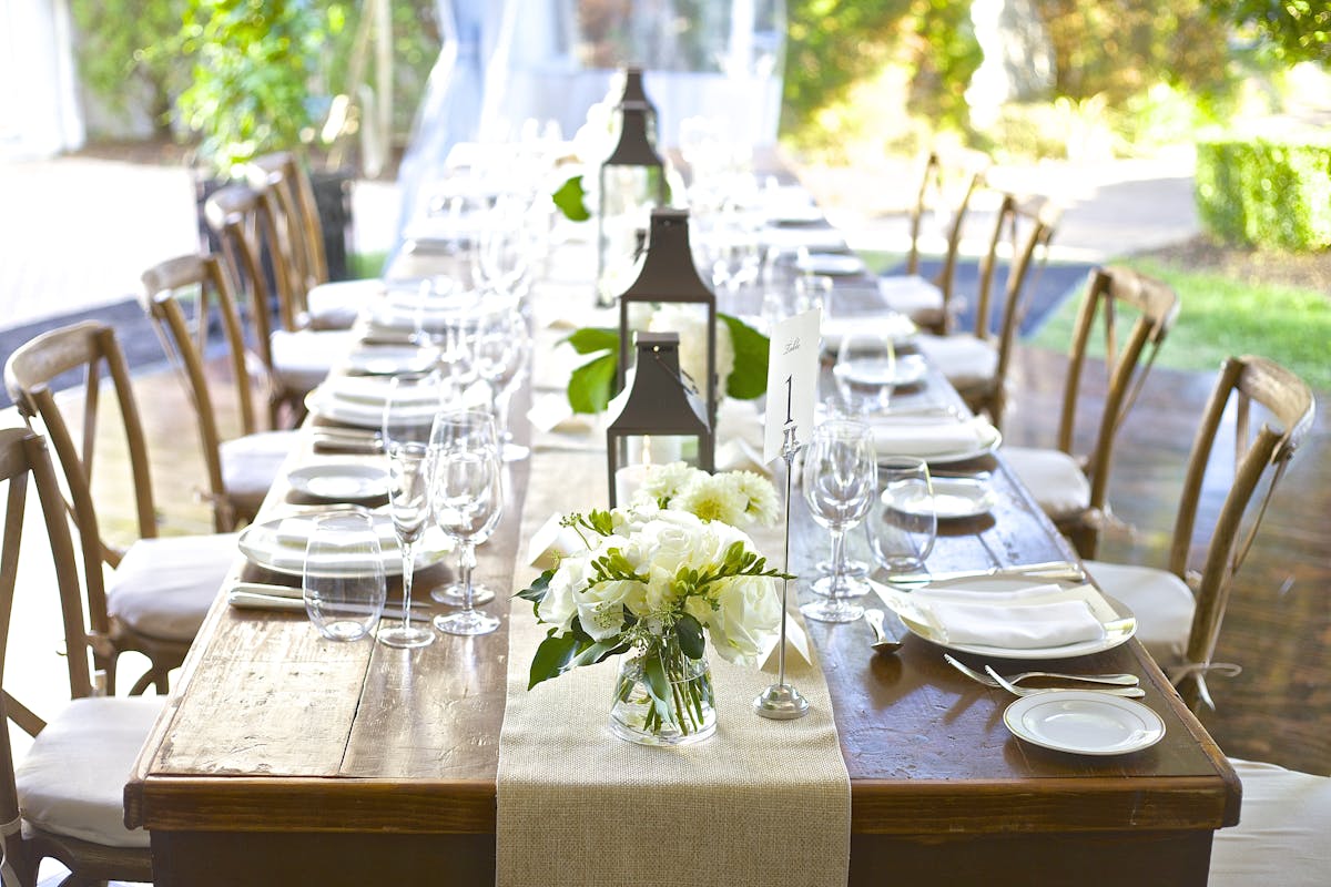 a dining table with wine glasses