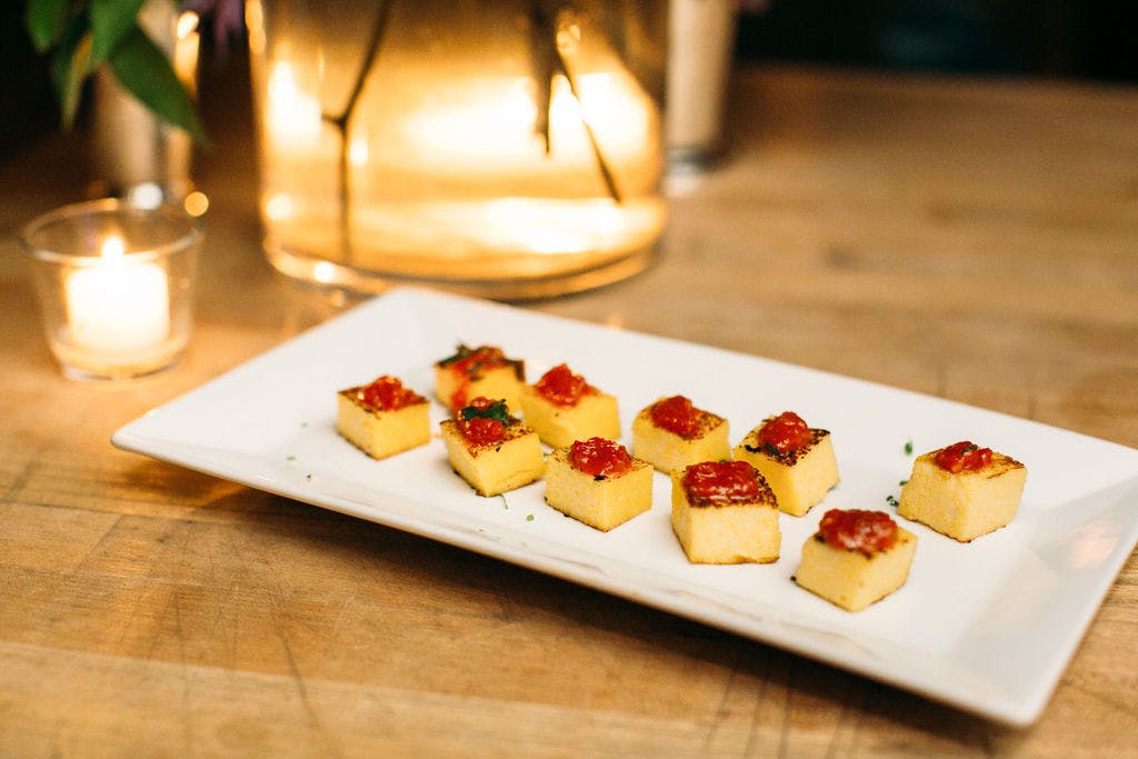 a plate of food sitting on top of a wooden table