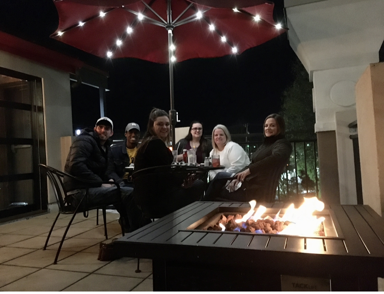 a group of people sitting at a table