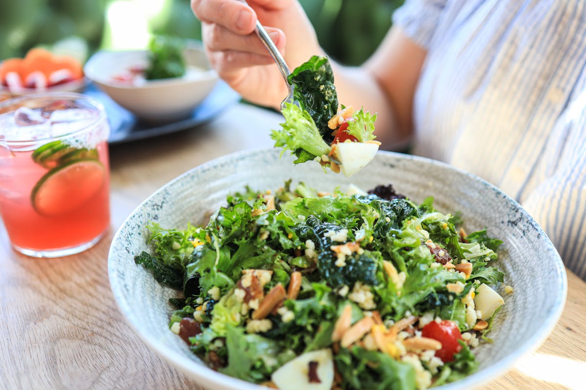a bowl of food with broccoli