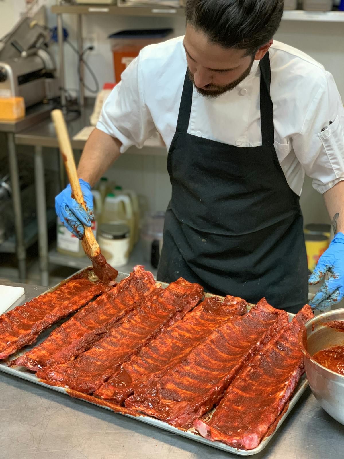 a man cooking meat