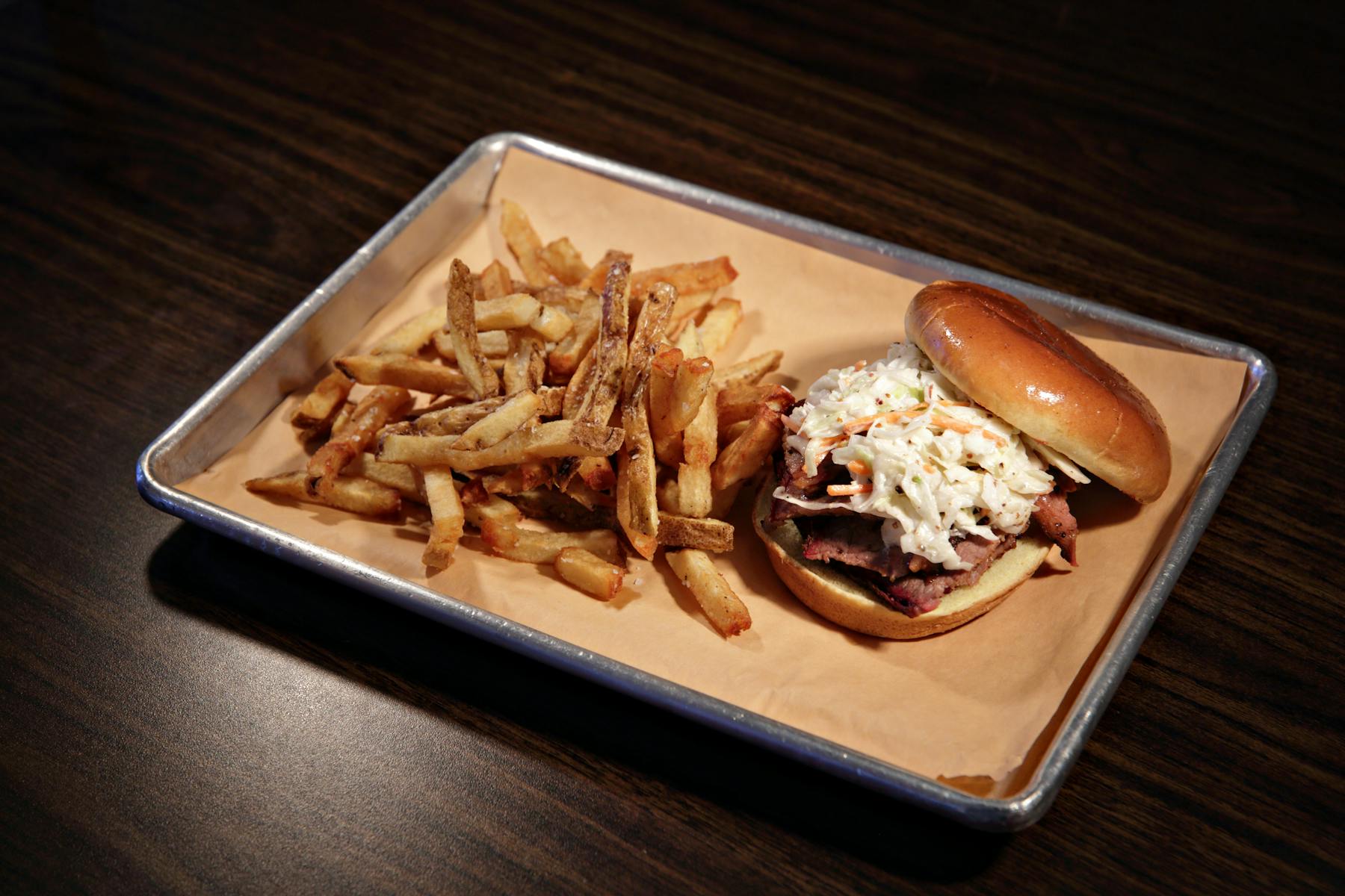 a plate of food sitting on top of a wooden table