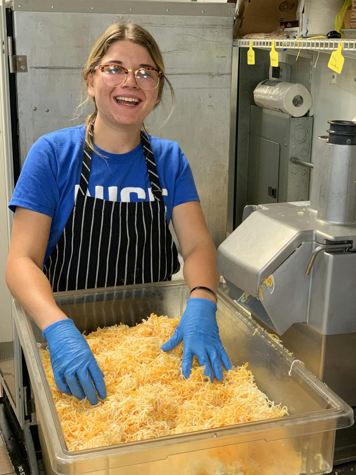 a woman standing in a kitchen