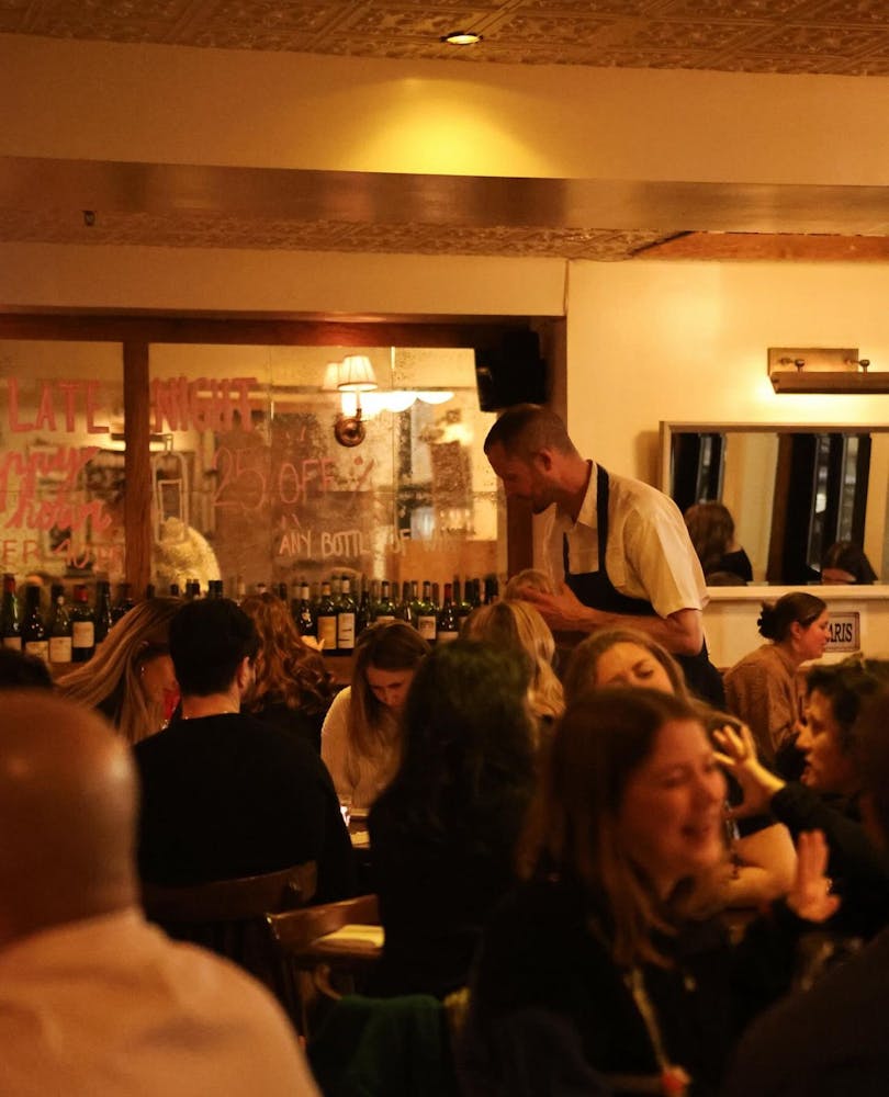 a row of wine glasses on a table